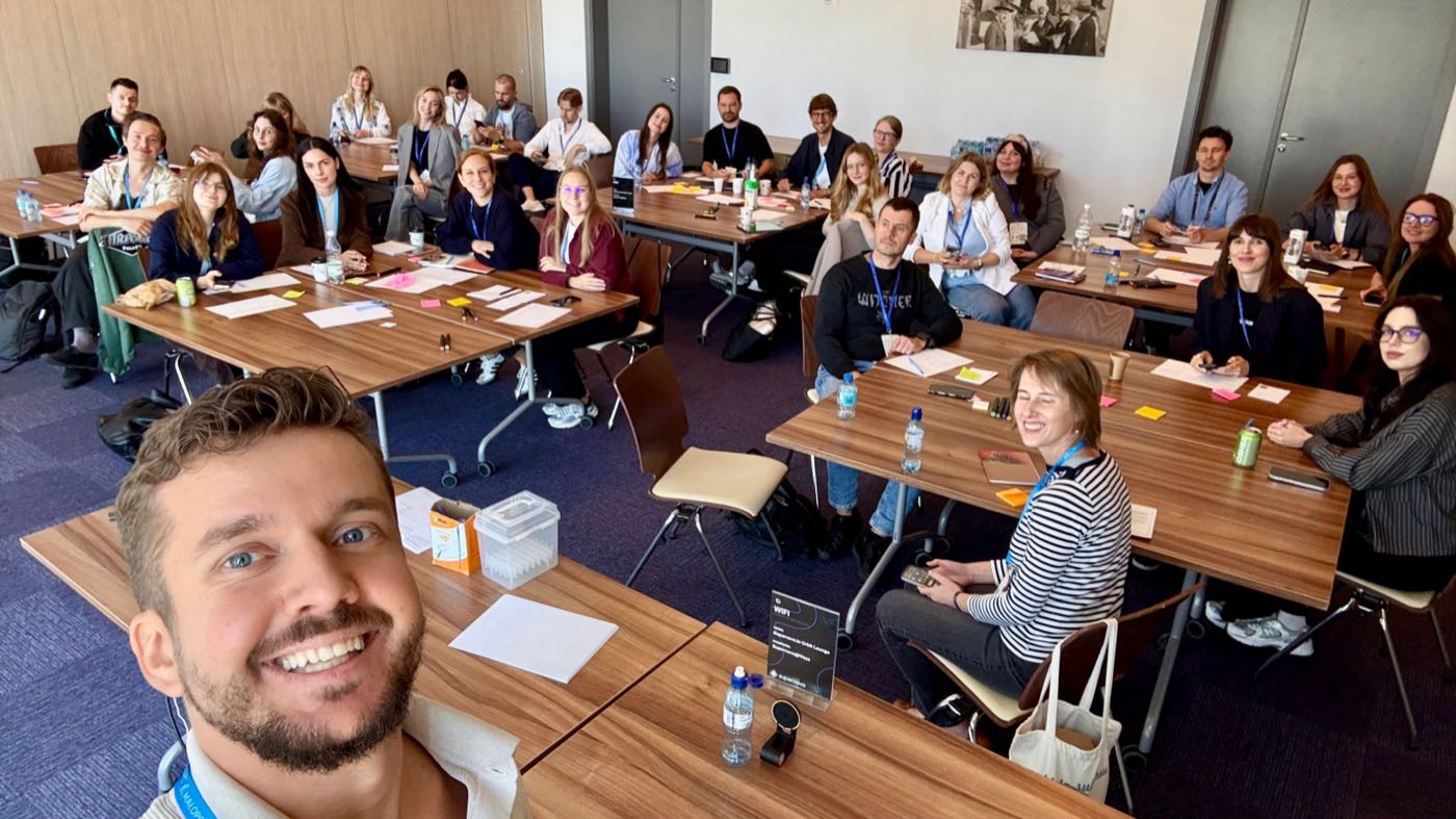 Twenty-eight participants seated at tables during the 3W Loop masterclass at WaysConf 2026